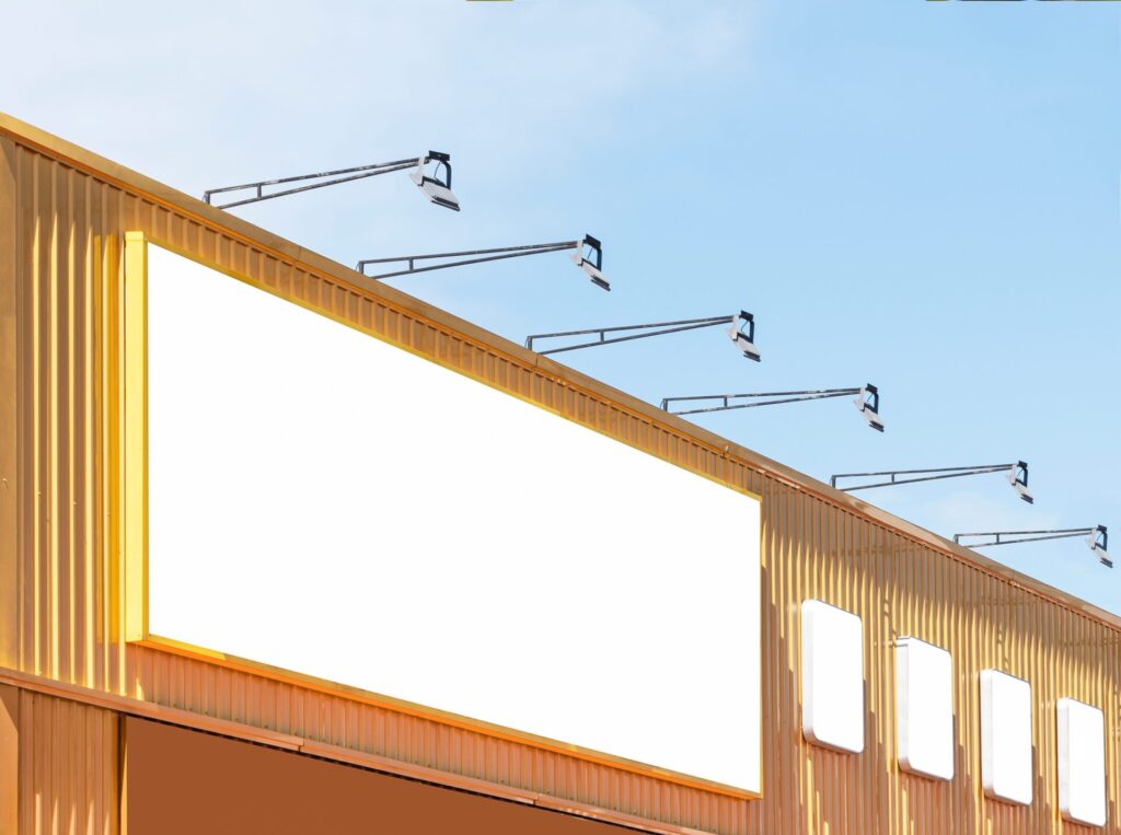 Mock,Up,White,Background,Billboard,On,Yellow,Building,With,Spot