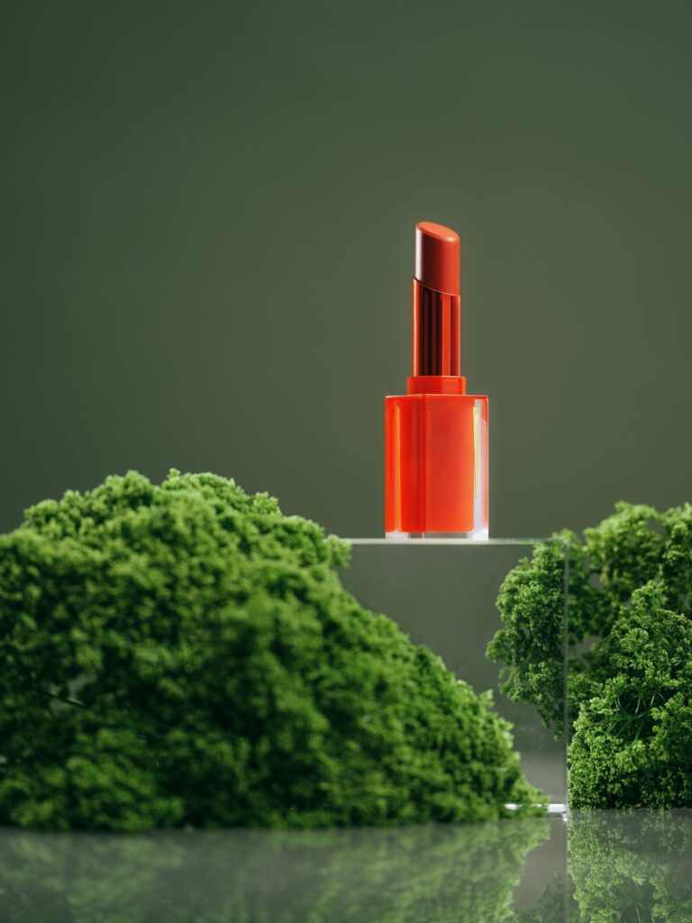 Lipstick,Standing,On,Moss,And,Stones,Podium.,Natural,Cosmetics,Concept