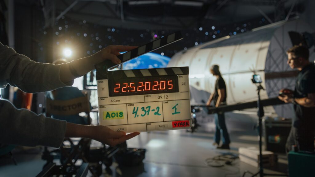 Director,Filming,Ad,Shoot,With,Astronaut,Fixing,Satellite.,Actor,Floats