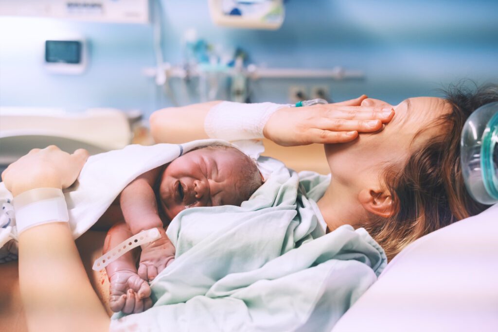 Mother,And,Newborn.,Child,Birth,In,Maternity,Hospital.,Young,Mom