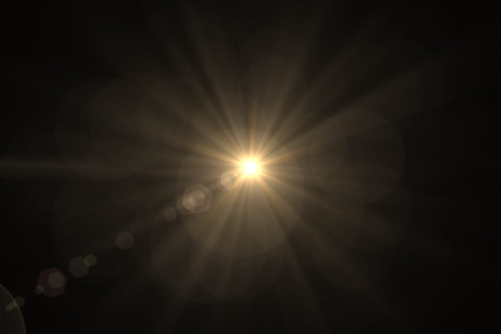 Natural,,Sun,Flare,On,The,Black,Background