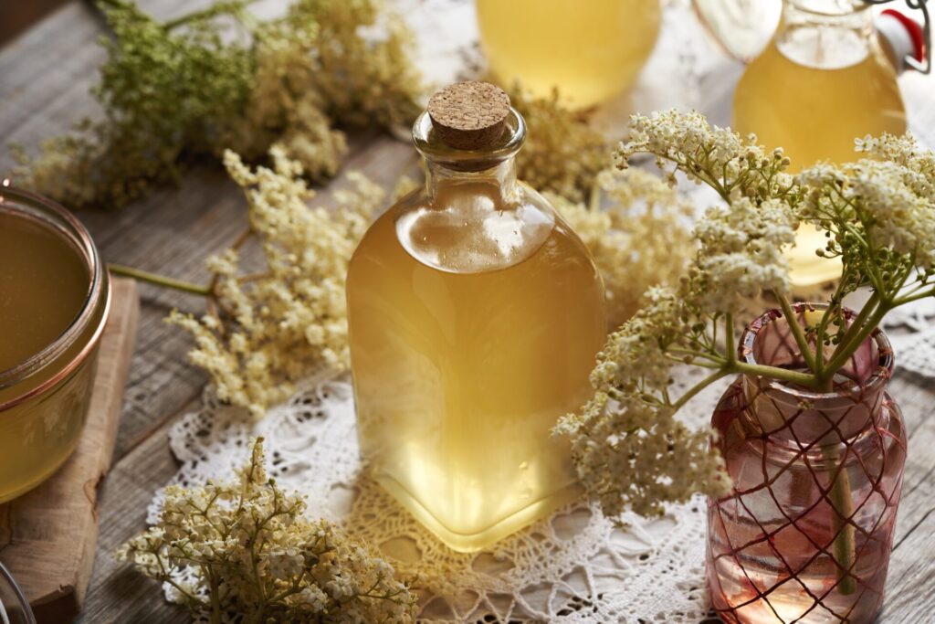 Homemade,Elderberry,Flower,Syrup,In,A,Transparent,Glass,Bottle