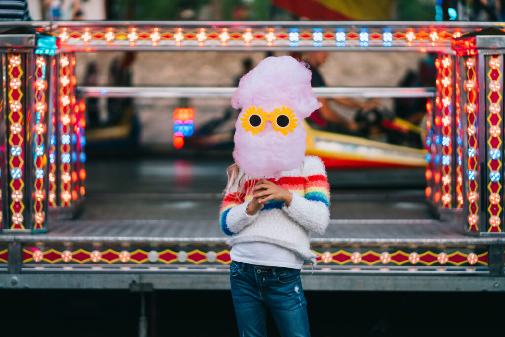 Little,Girl,Holding,A,Cotton,Candy,With,Funny,Sunglasses,In