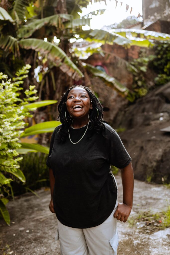 Black,Woman,Smiling,At,Camera,,Looking,At,Camera