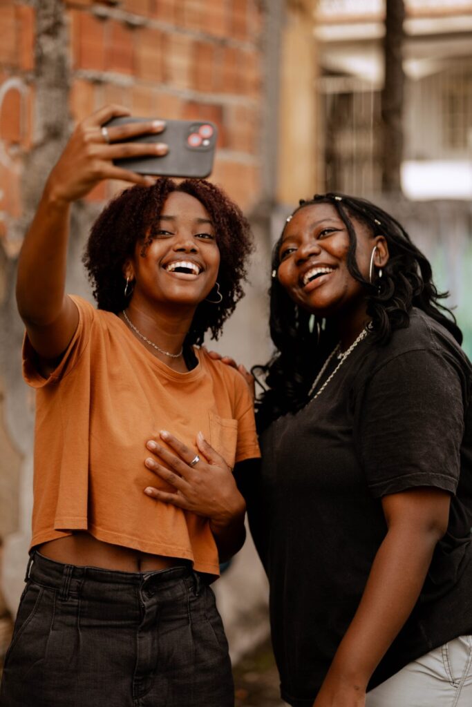 Black,Women,Smiling,Towards,The,Camera,,Looking,At,The,Camera,