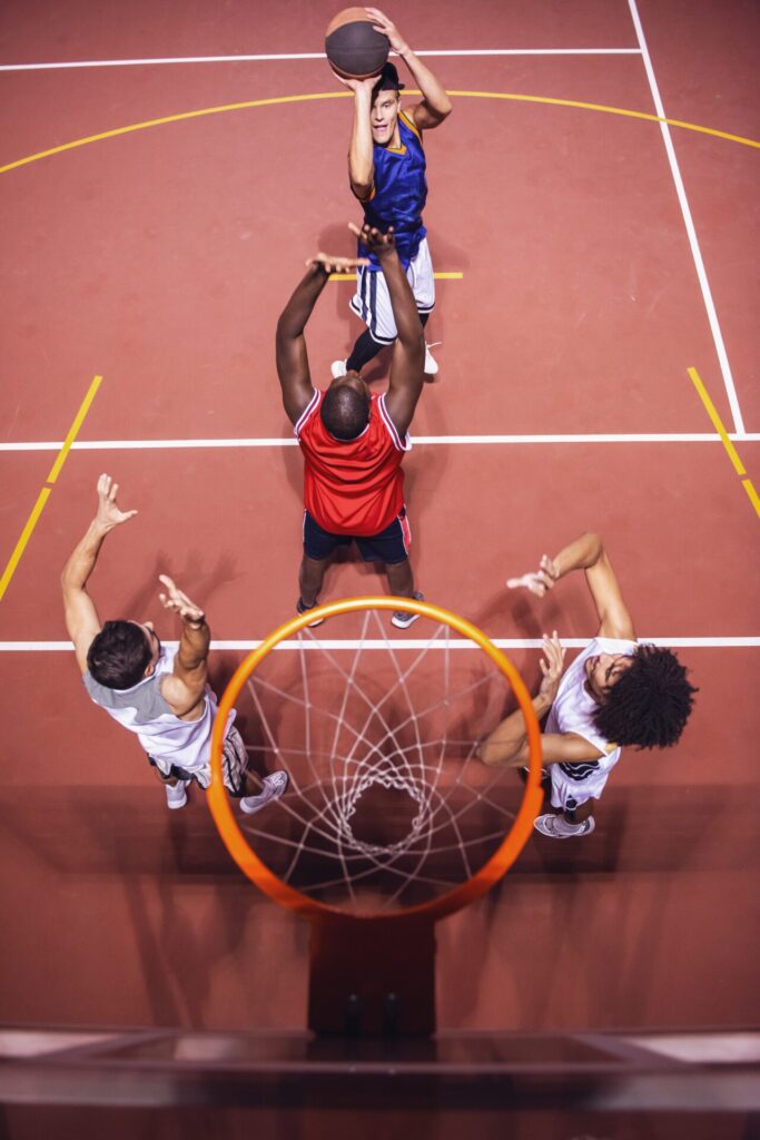 High,Angle,View,Of,Handsome,Guys,Playing,Basketball,Outdoors,At