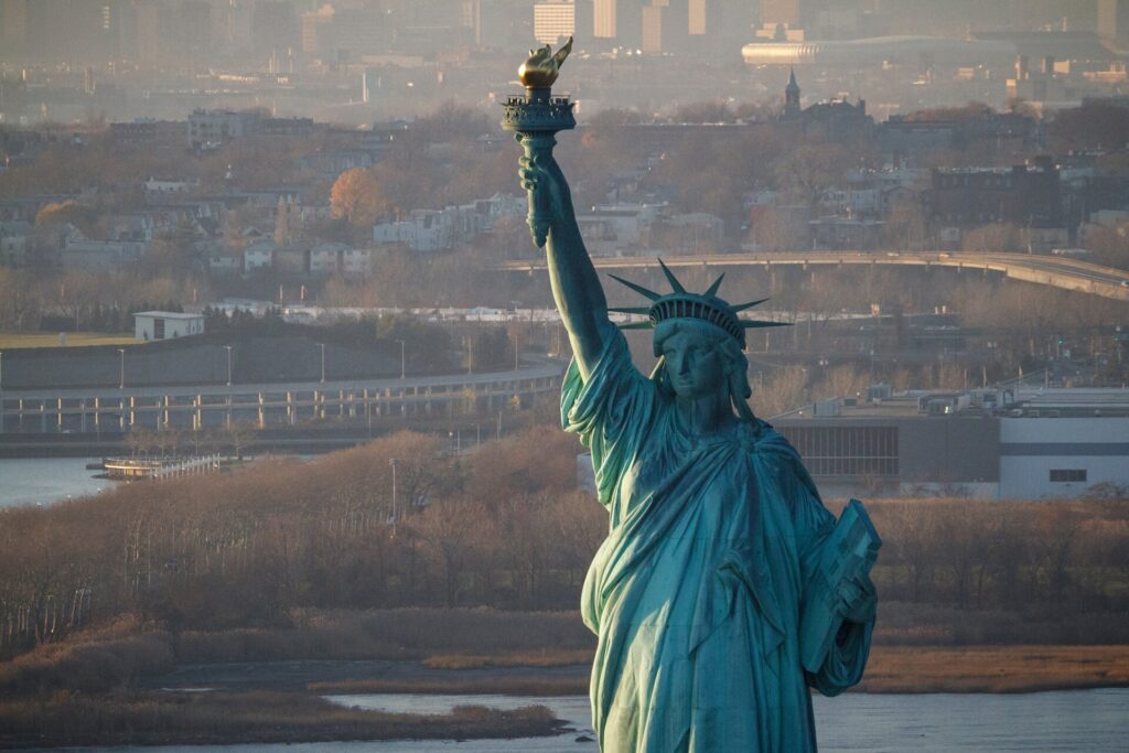 Sunset,On,The,Statue,Of,Liberty,In,New,York,Harbor,