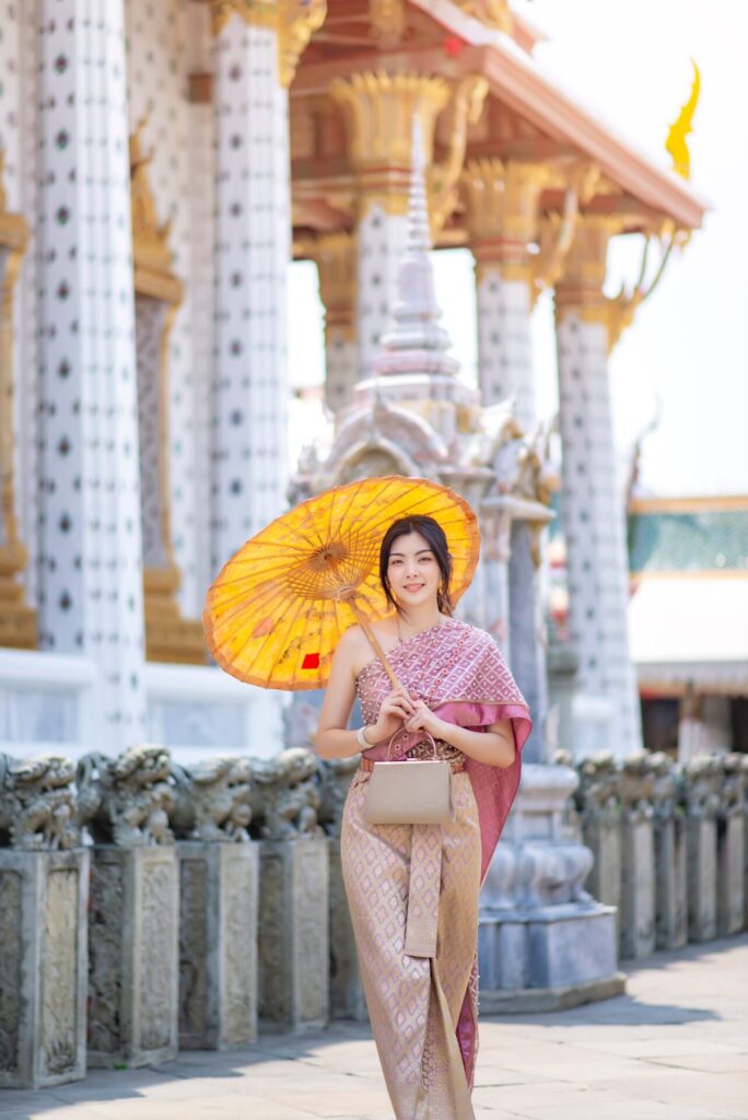 Beautiful,Asian,Girl,In,Thai,Traditional,Costume,At,Temple