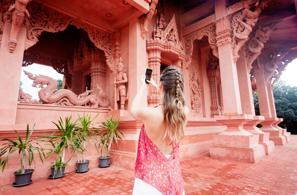 Young,Woman,Photographing,Temple,In,Ko,Samui,,Thailand