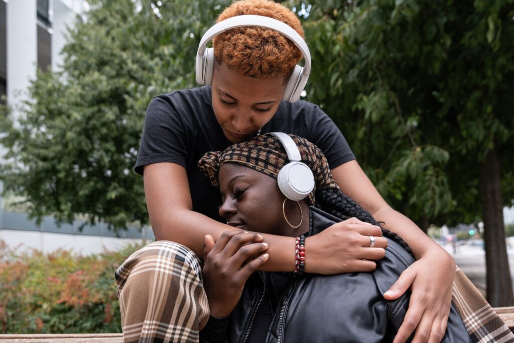 An,Affectionate,Multiethnic,Lgbt,Couple,,Embracing,Outdoors,,Share,A,Tender